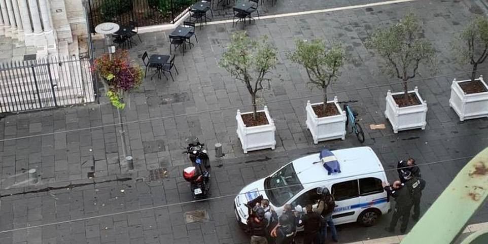Armed police approach the church where the attack is thought to have started during Mass