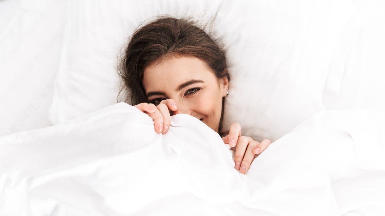woman smiling in bed