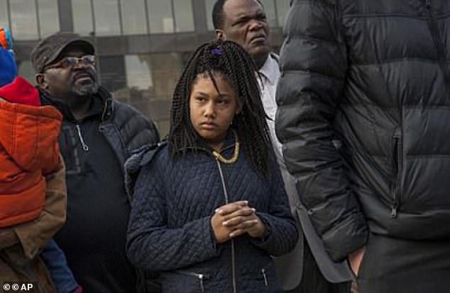 Honestie Hodges listens during a Greater Grand Rapids NAACP press conference at Calder Plaza in downtown Grand Rapids, 2017