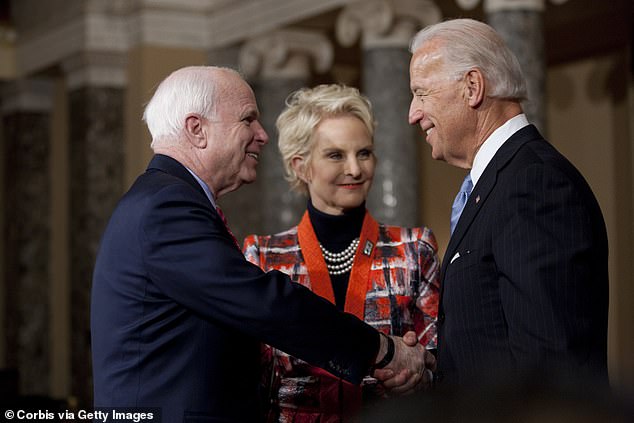 From left: Then-Senator John McCain, Cindy McCain, and then-Vice President Joe Biden are seen on Capitol Hill in this 2011 photo