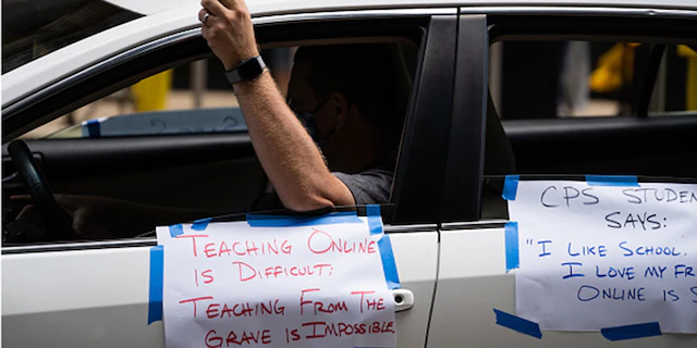 Chicago Teachers Union members and supporters join a car caravan outside Chicago Public Schools (CPS) headquarters while a Chicago Board of Education meeting takes place inside in Chicago, Ill., on July 22, 2020. (Max Herman/NurPhoto via Getty Images)