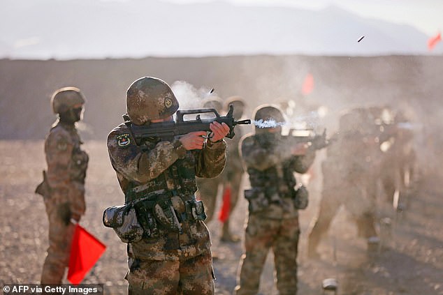 Speaking to South China Morning Post, Hong Kong-based military commentator Song Zhongping said: 'China is indeed facing a great risk of war, which has been seriously implied in this order.' Chinese soldiers are seen taking part in military training in Kashgar on January 4