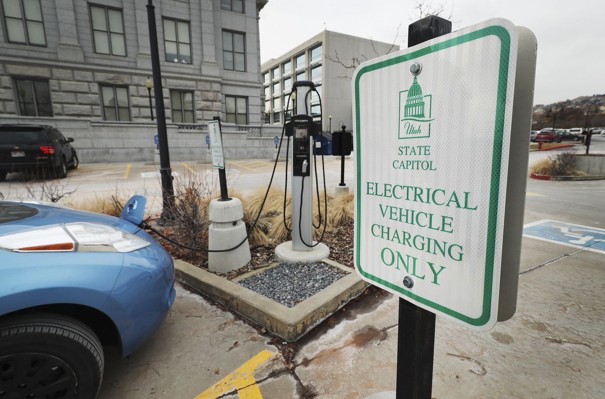 An electric vehicle is charged at the Capitol in Salt Lake City on Tuesday, Dec. 31, 2019. On New Year’s Day, Utah is becoming only the second state in the U.S., after Oregon, to roll out an ongoing and fully operational “road user charge” program that electric and hybrid vehicle users can opt in to pay for the miles they drive measured by a device in their car.