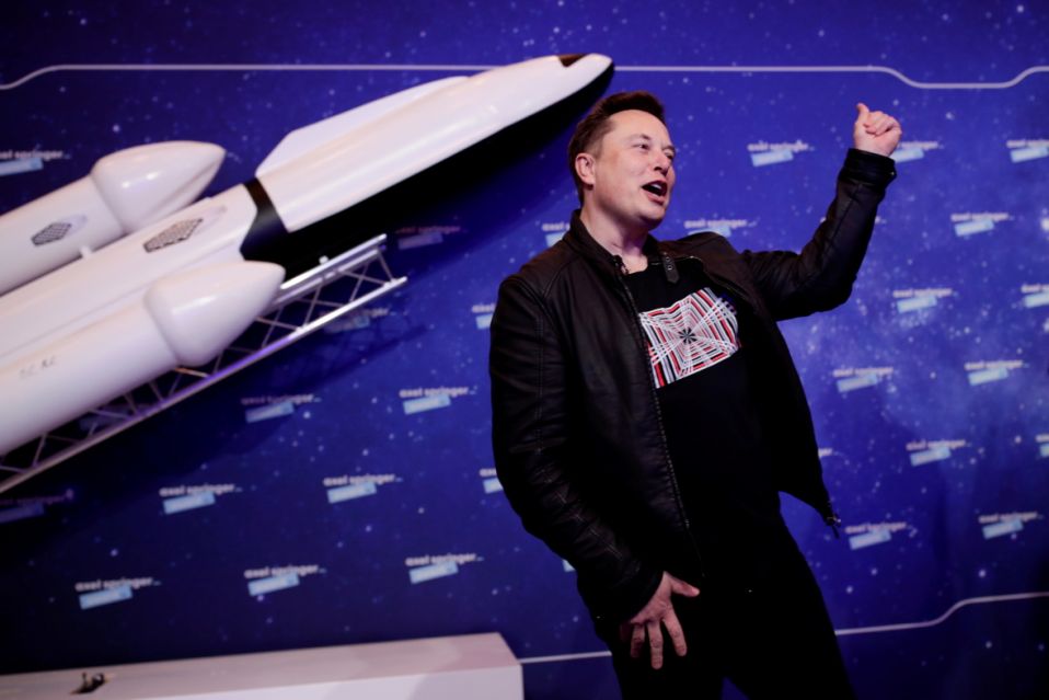 SpaceX owner and Tesla CEO Elon Musk gestures after arriving on the red carpet for the Axel Springer award, in Berlin, Germany, December 1, 2020. REUTERS/Hannibal Hanschke/Pool     TPX IMAGES OF THE DAY