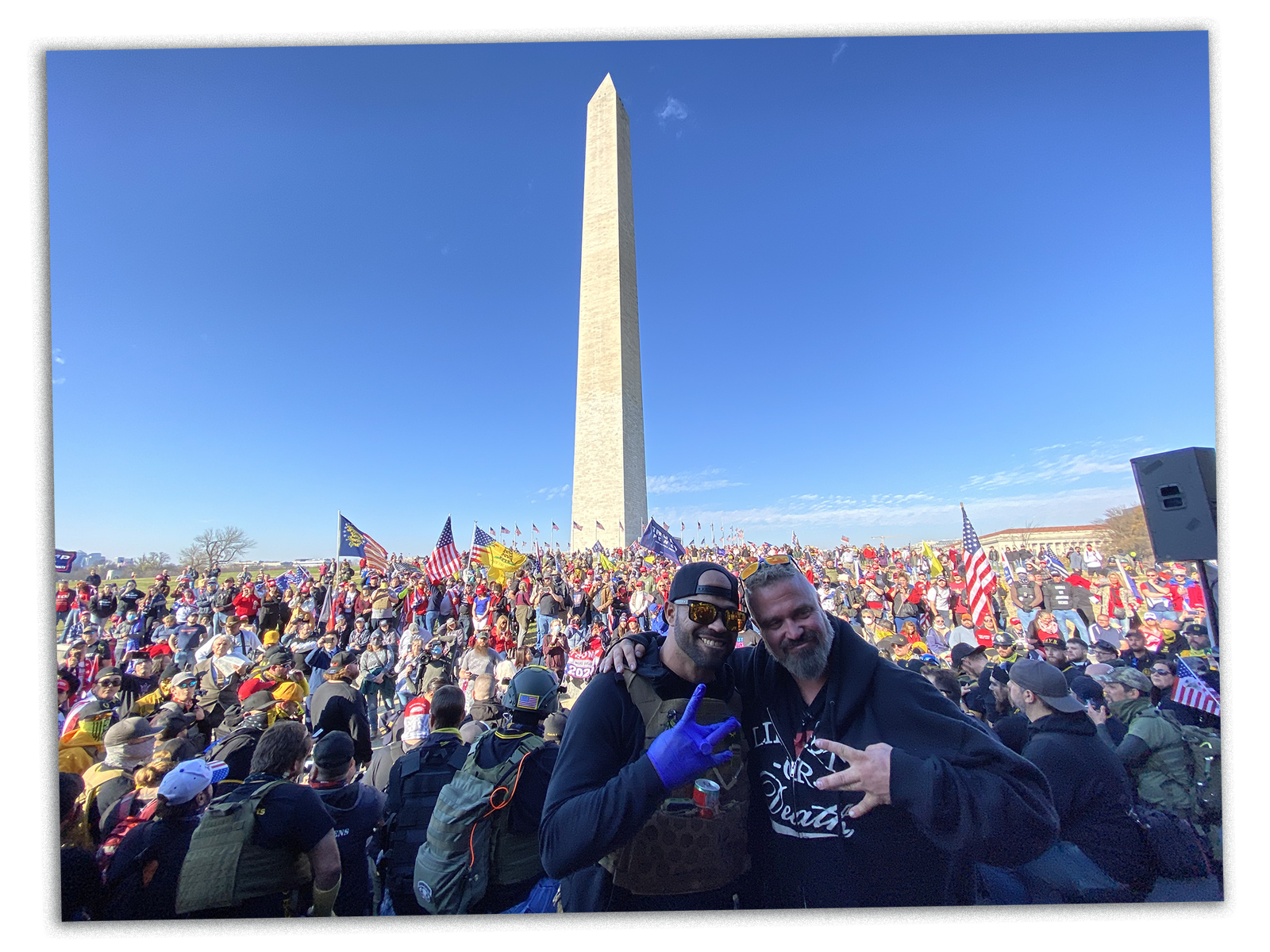 Enrique Tarrio and Joe Biggs of the Proud Boys pose for a photo as Trump supporters gather in front of the Washington...