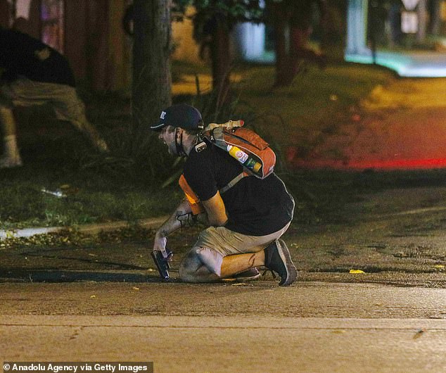 Gaige Grosskreutz is seen after being shot in the arm during the riots and protests in Kenosha, Wisconsin in 2020