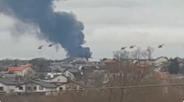 Russian Mi-8 attack helicopters stage an assault on Gostomel air base, just on the outskirts of Kiev, after Vladimir Putin launched an all-out attack on the country