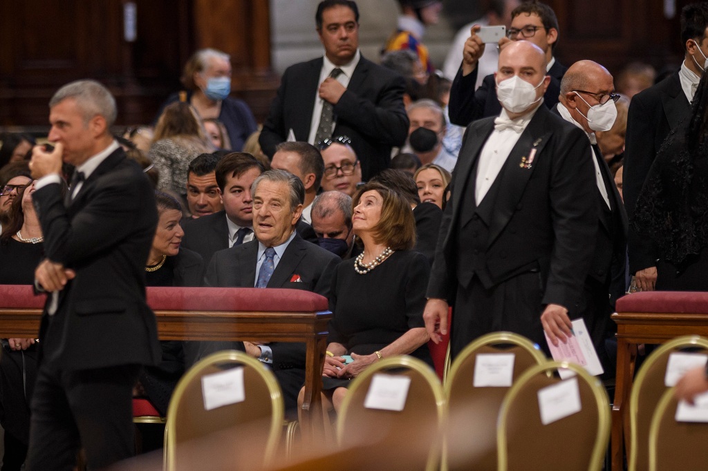 Pelosi flashes a smile in the presence of bishops and cardinals during the Holy Mass for Saints Peter and Paul.