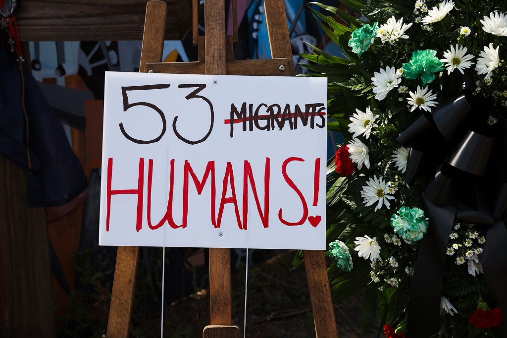 People visit and commemorate as they leave flowers, candles and water, where dozens of dead migrants found in a truck in San Antonio, Texas, United States on June 29, 2022. 