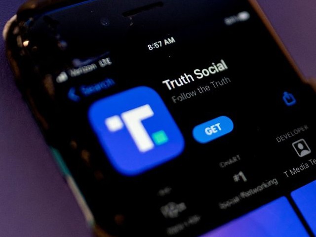 A phone screen displays the Truth Social app in Washington, DC, on February 21, 2022. (Photo by STEFANI REYNOLDS/AFP via Getty Images)