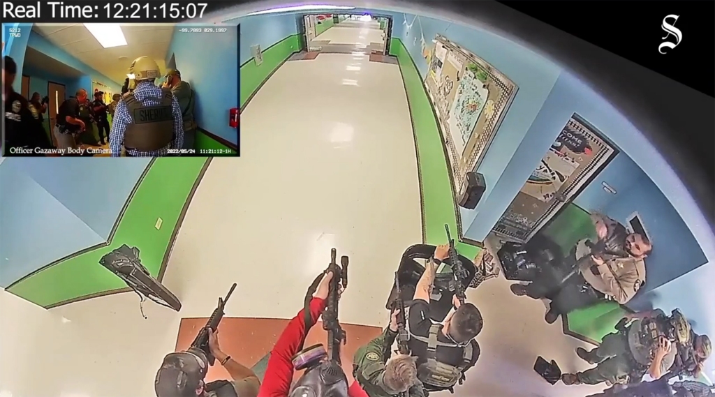 Video of cops walking down the hallway.