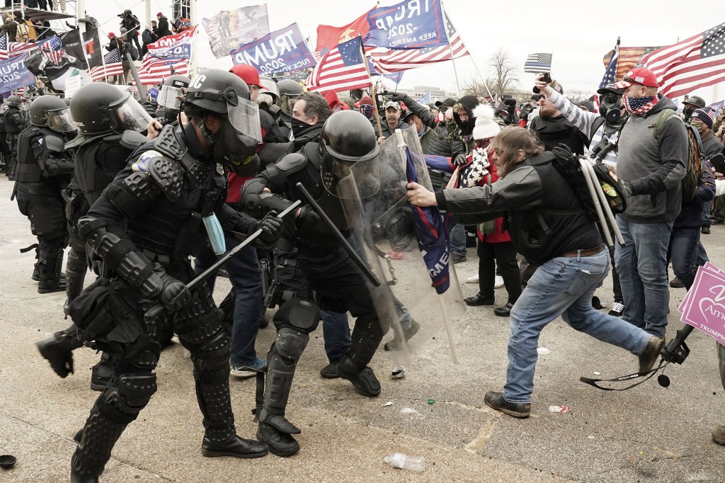 Pro-Trump rioters breach the security perimeter and penetrate the US Capitol.