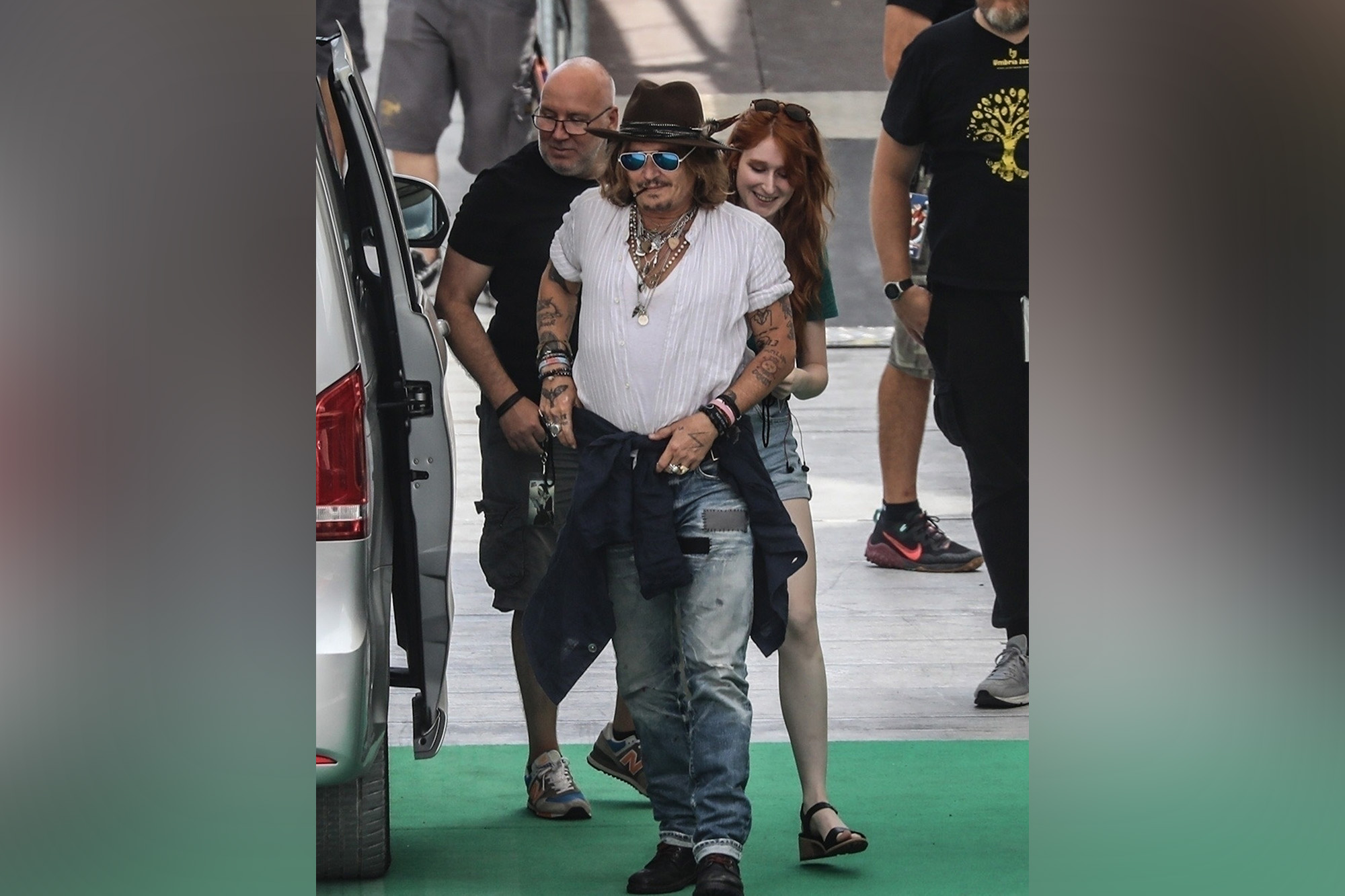 Johnny Depp arrives in Italy with raven-haired French teacher