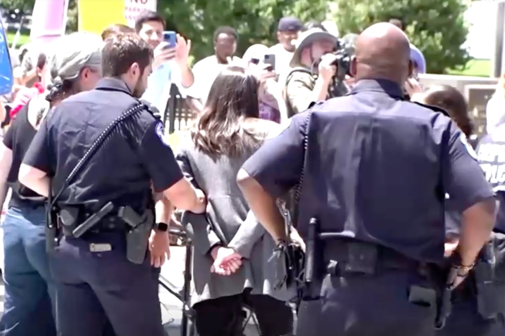 AOC was quickly mocked on social media for her faux handcuffs.