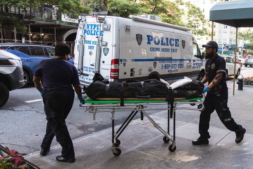 Medical examiners remove Diane Gallagher from her home after she was killed.  