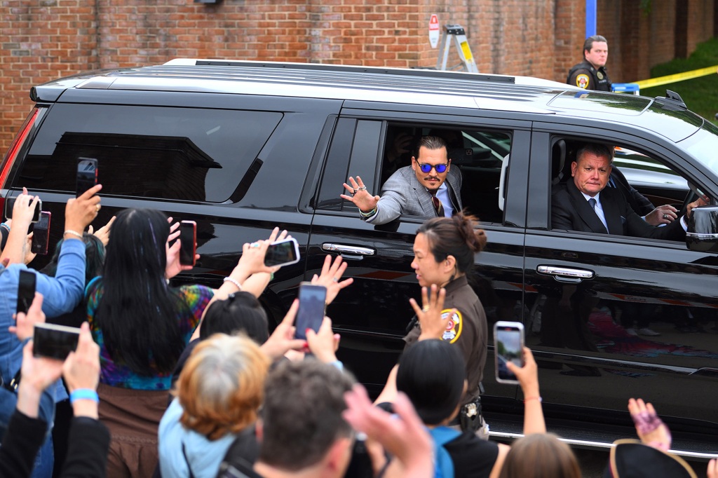 Johnny Depp is seen leaving Fairfax Courthouse In Virginia waiving and smiling to his fans supporters outside court while Depp Amber Heard trial comes to an end.