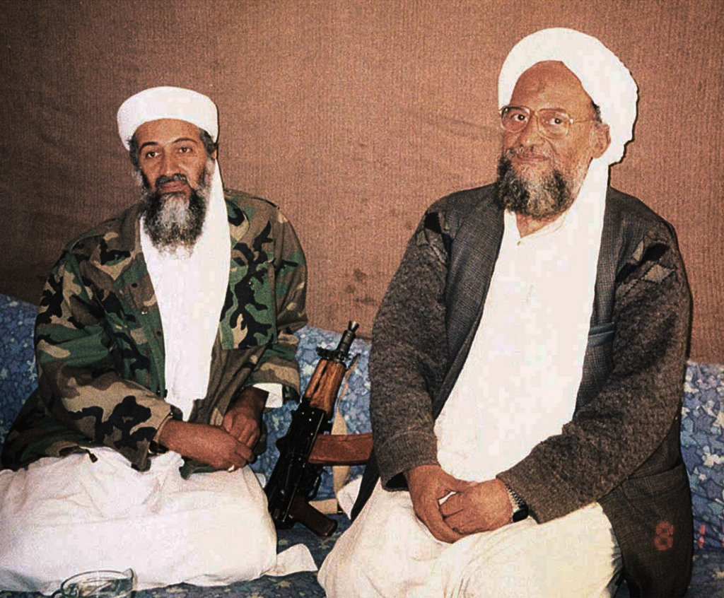 Osama bin Laden (L) sits with his adviser Ayman al-Zawahiri,