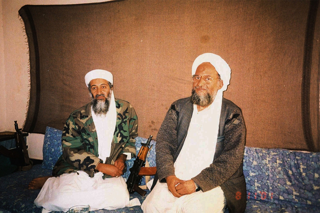 Osama bin Laden sits with his advisor Ayman al-Zawahri during an press interview on November 10, 2001.