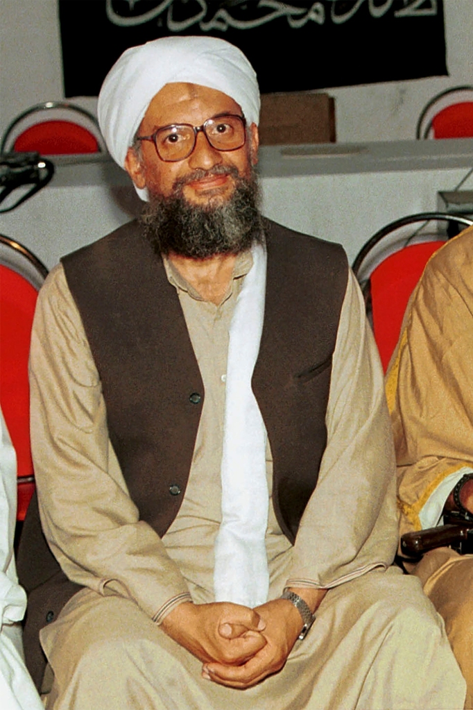 In this 1998 file photo made available Friday, March 19, 2004, Ayman al-Zawahri poses for a photograph with Osama bin Laden, at right unseen, in Khost, Afghanistan.