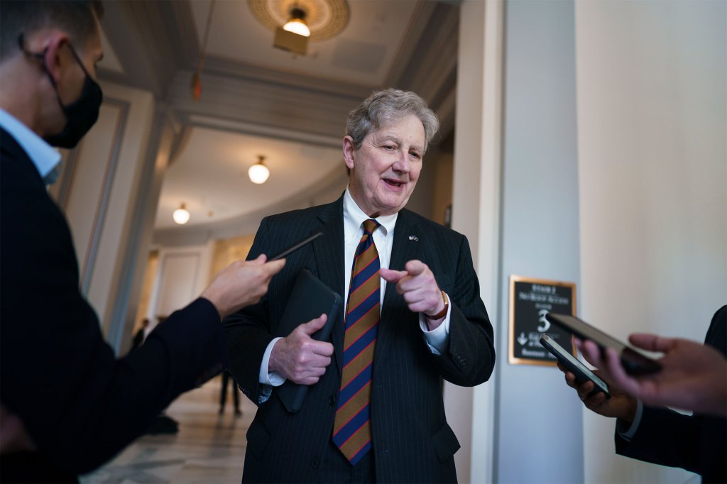 Sen. John Kennedy pauses for reporters as senators rush to the chamber for votes ahead of the approaching Memorial Day recess at the Capitol