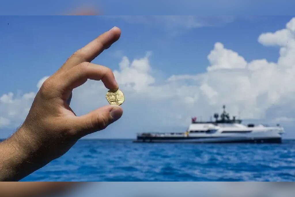 Man holding gold coin.