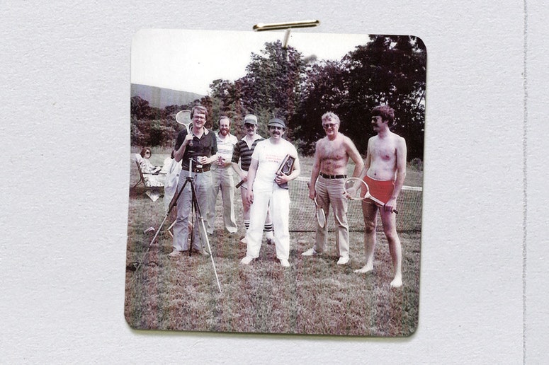 men standing on a lawn