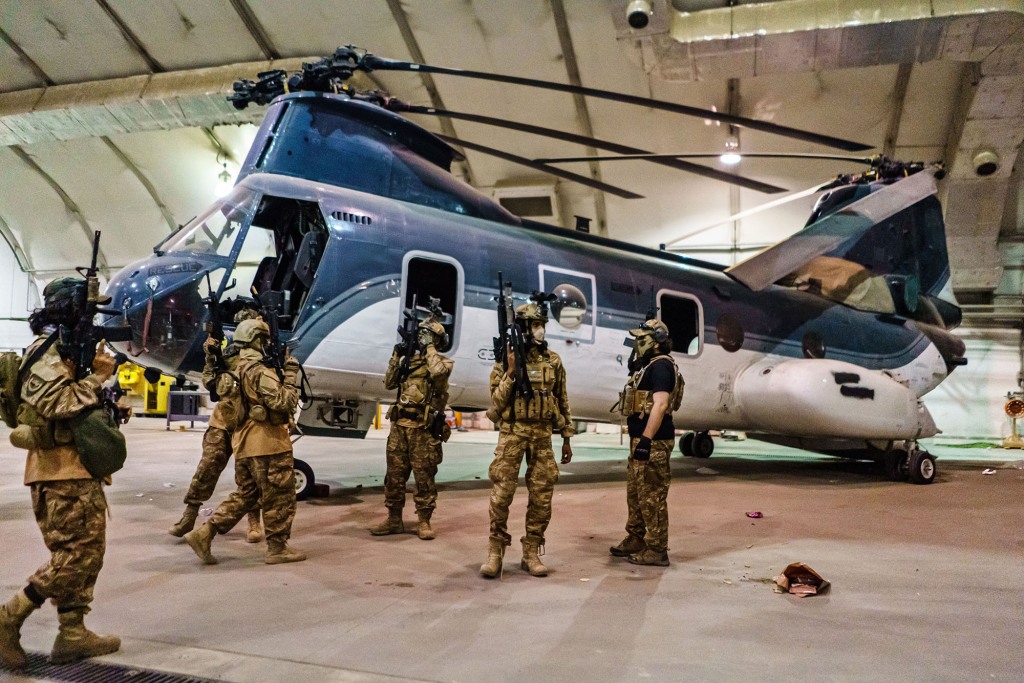 Taliban fighters from the Fateh Zwak unit, wielding American supplied weapons, equipment and uniforms, storm into the Kabul International Airport