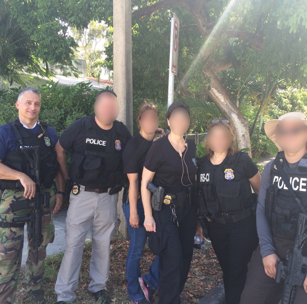 "To be armed is smart," said Domenicis (far left) of busting potentially violent federal criminals. "I wouldn't try to arrest somebody without it."