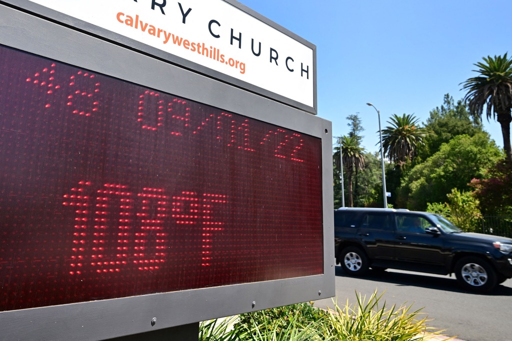 The temperature reads 108 degrees Farenheit (42 degrees Celsius) before noon on an electronic sign borad at the Calvary Church in West Hills, California on September 1, 2022