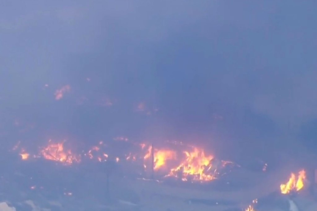Fire crews were dropping fire retardant from the air to fight the growing blaze.  