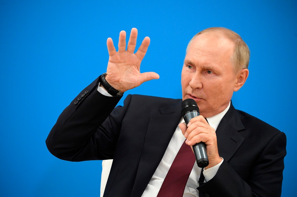 Putin was seen shifting in his seat while addressing Russian students.