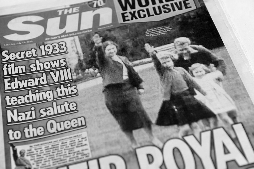A picture of the Sun newspaper front cover of Queen Elizabeth as a child giving the Nazi salute. 