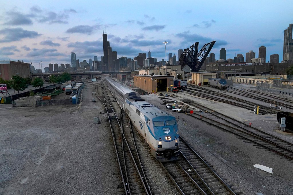 An Amtrak passenger train departs Chicago in the early evening headed south Wednesday, Sept. 14, 2022,