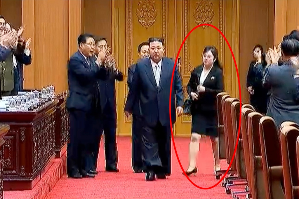Kim Jong Un at North Korea's parliament with a mystery woman who may be his new assistant.