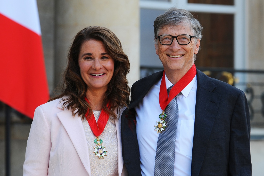 Bill and Melinda Gates pose in front of the Elysee Palace after receiving the award of Commander of the Legion of Honor by French President Francois Hollande on April 21, 2017 in Paris, France